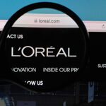 L’OREAL logo under magnifying glass